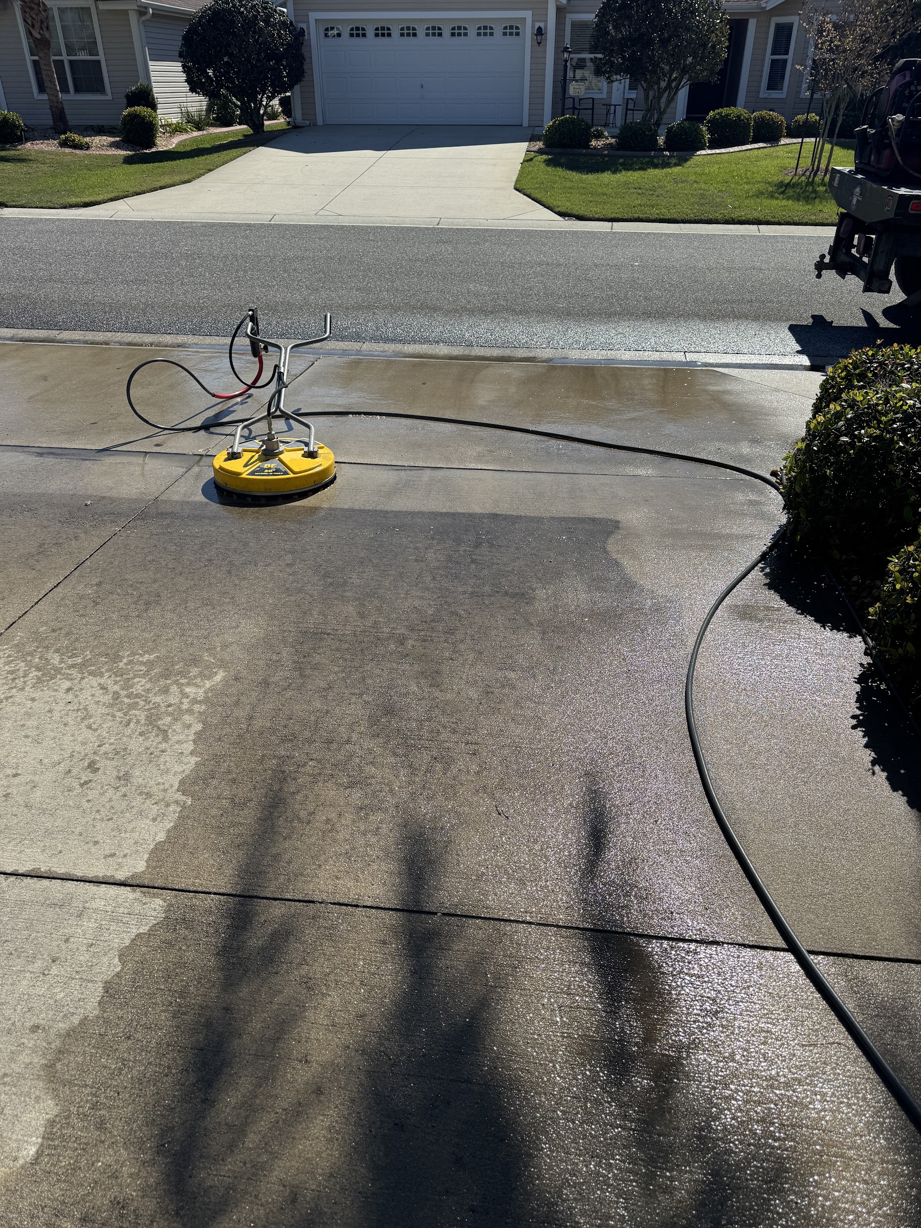 Compton Services commercial pressure washing a Villages driveway