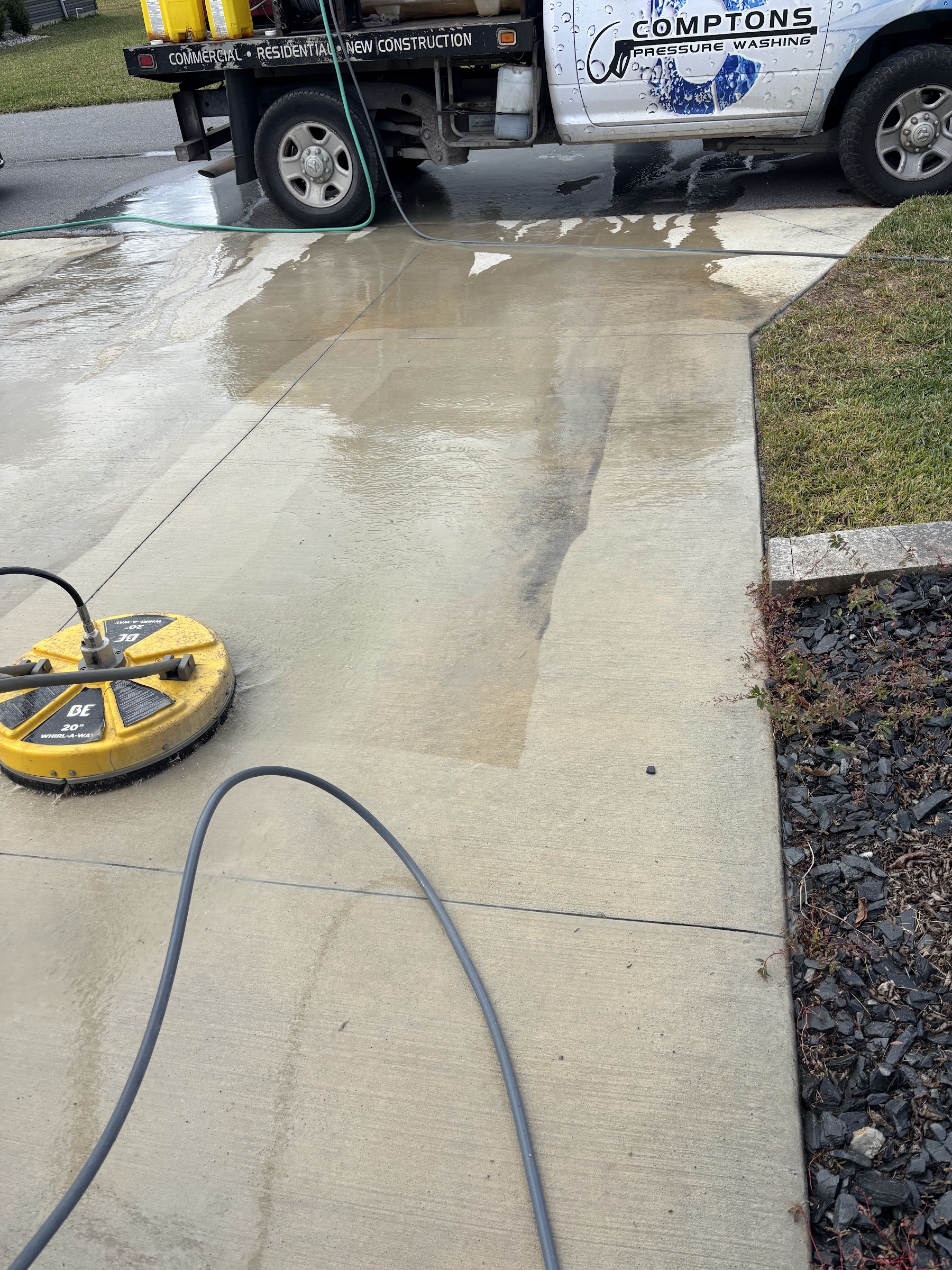 Compton Services truck and surface cleaner on residential driveway